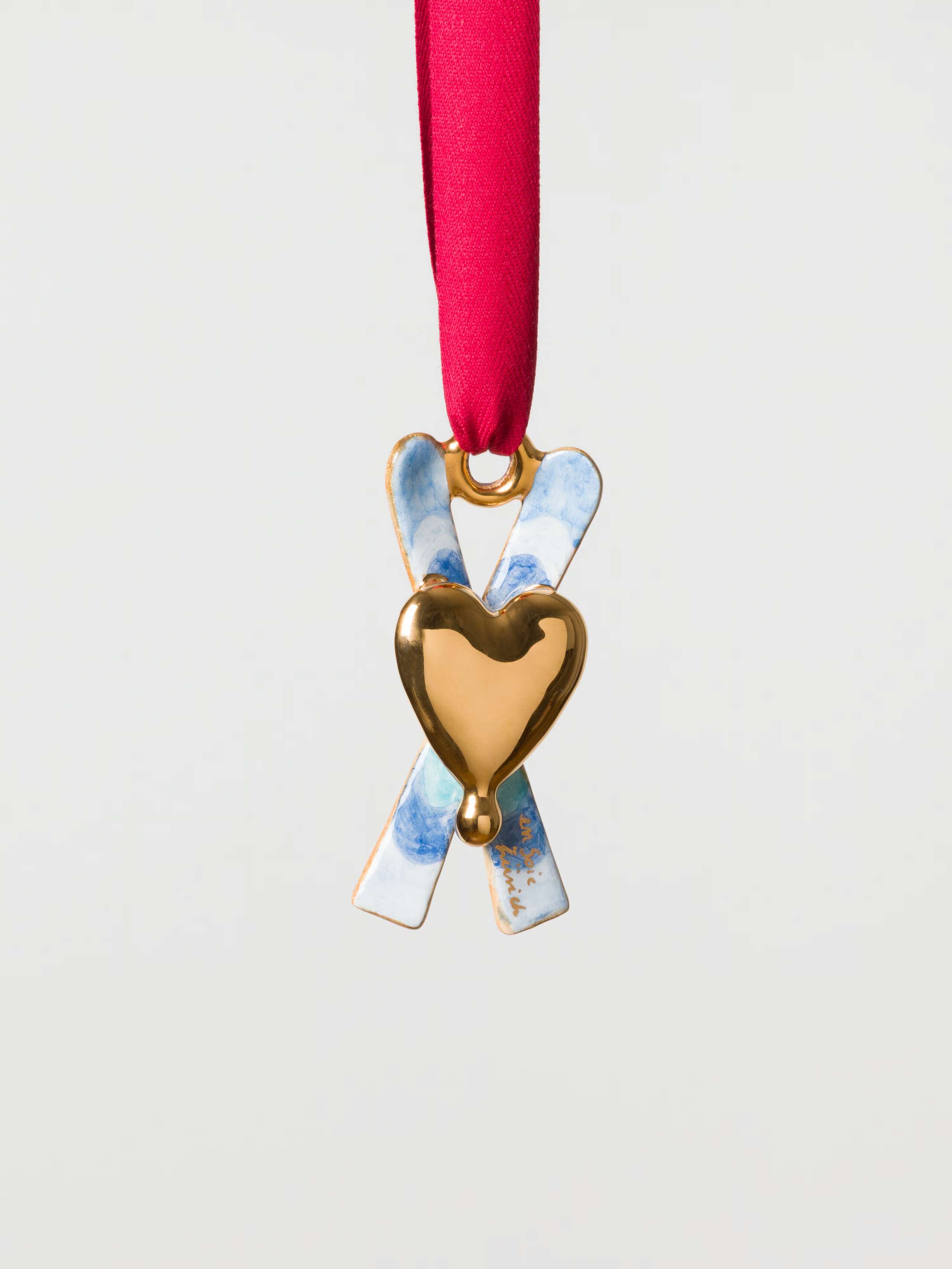 Blue Skis with golden heart ceramic ornament