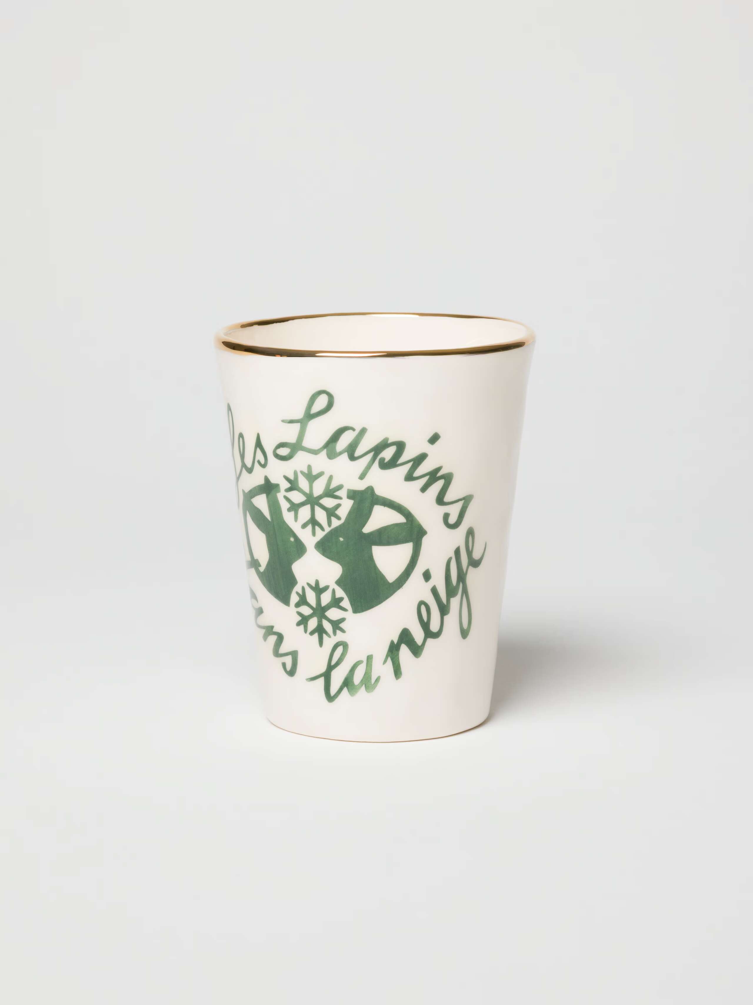 Picture of a hand-painted cup with a rabbit motif.