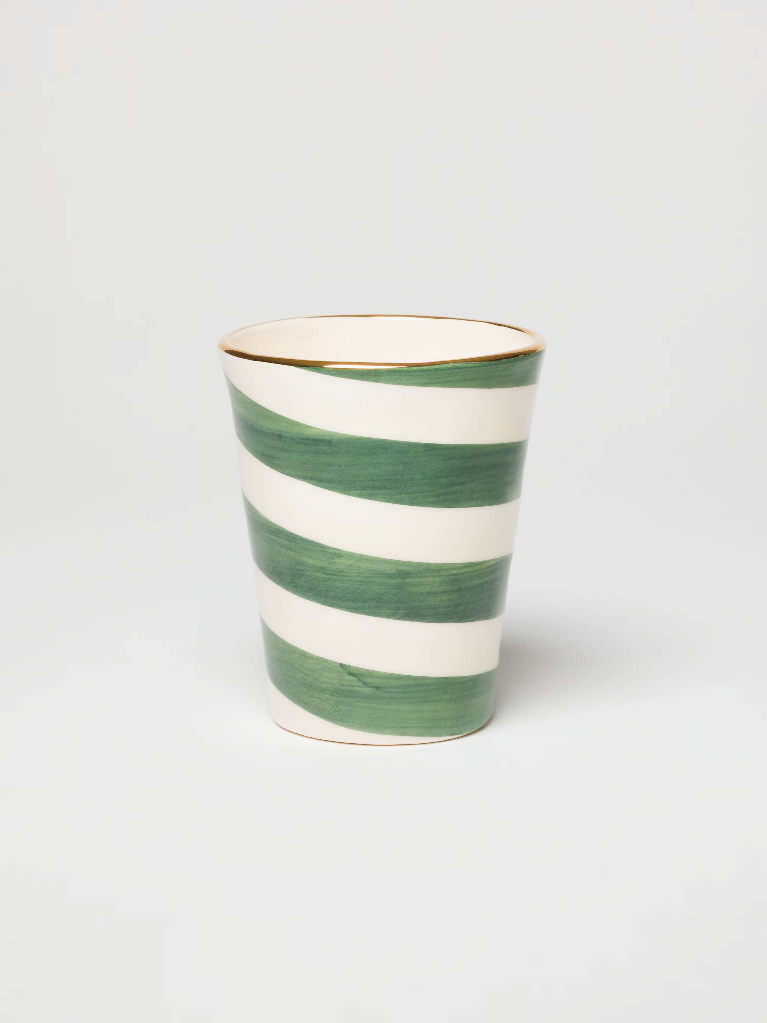 Picture of a hand-painted cup with a spiral motif.
