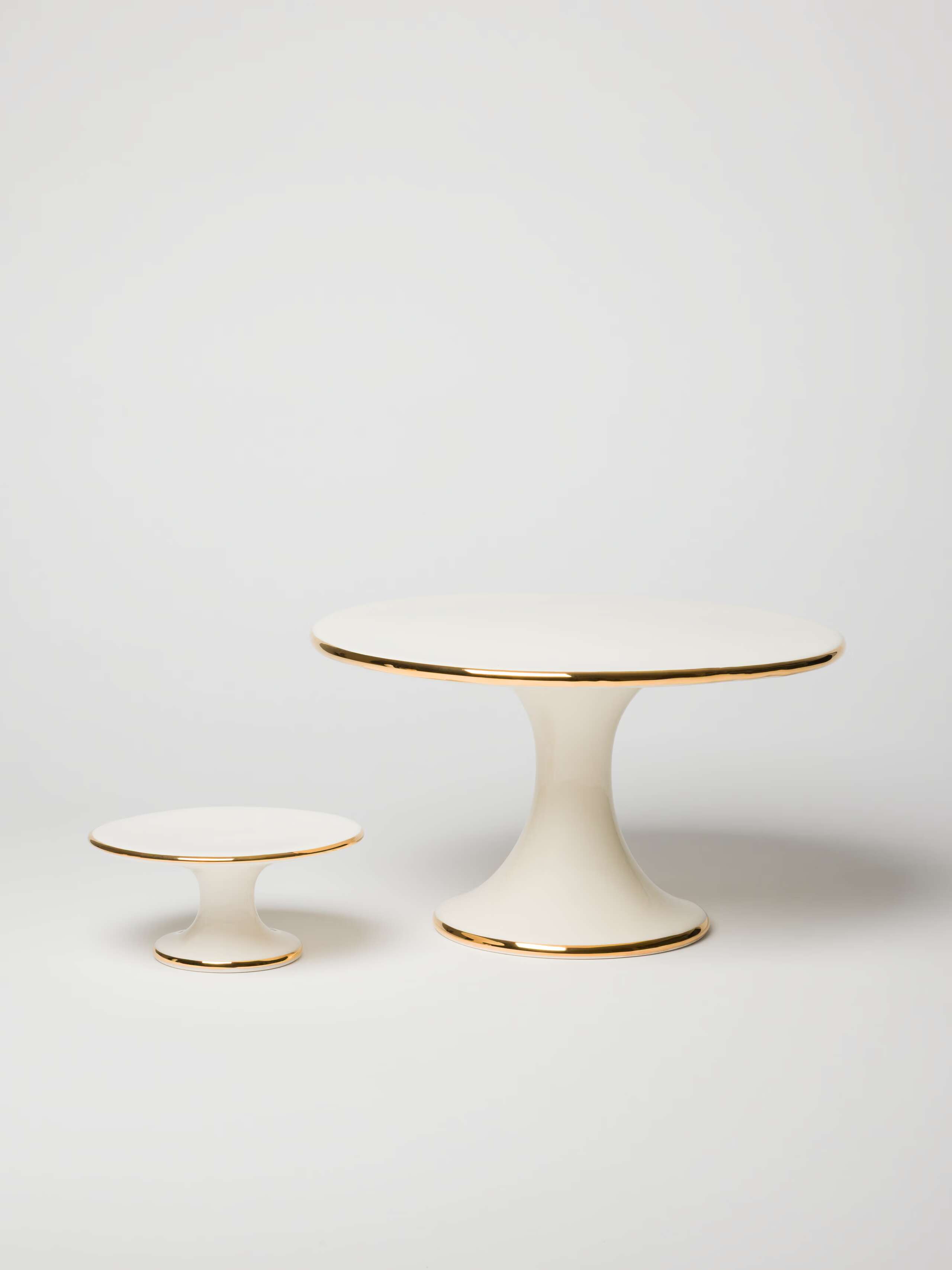White ceramic cake stand with gold rim, handmade