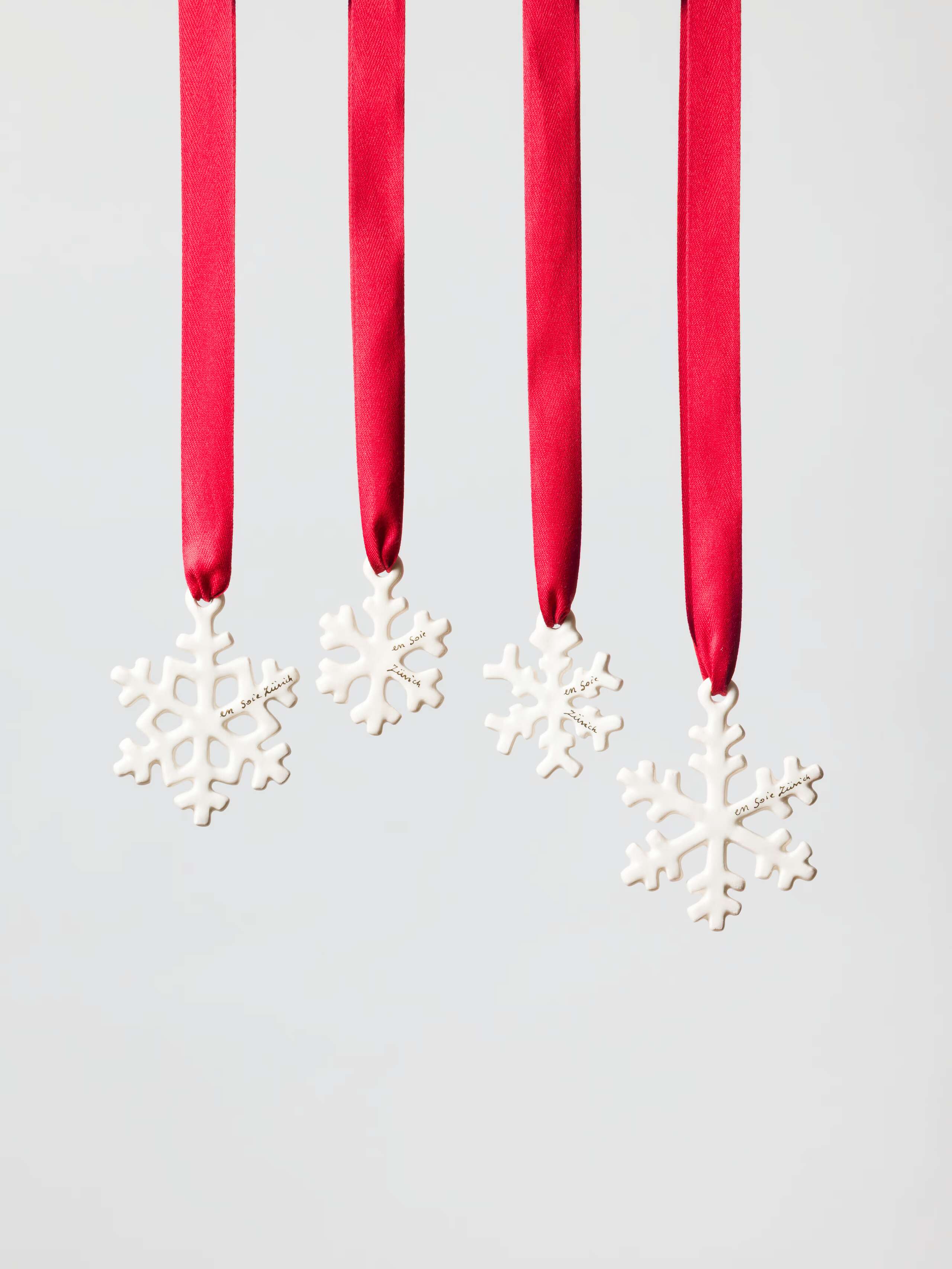 snowflake ornaments in white