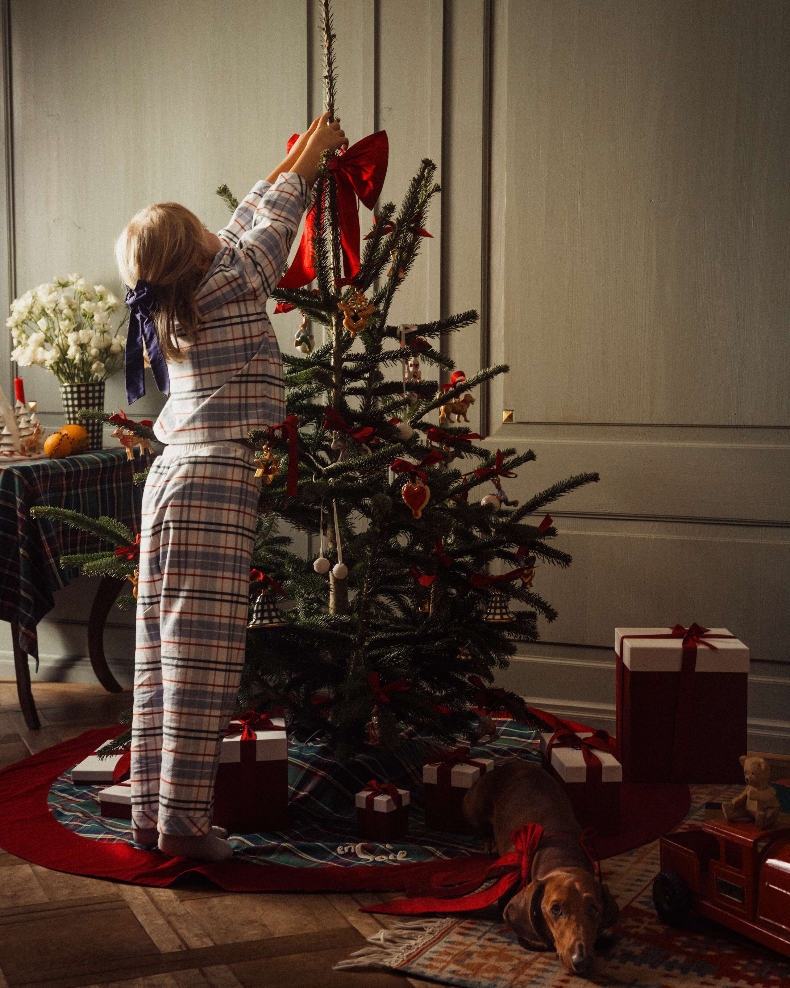 Picture of a girl decorating a christmas tree