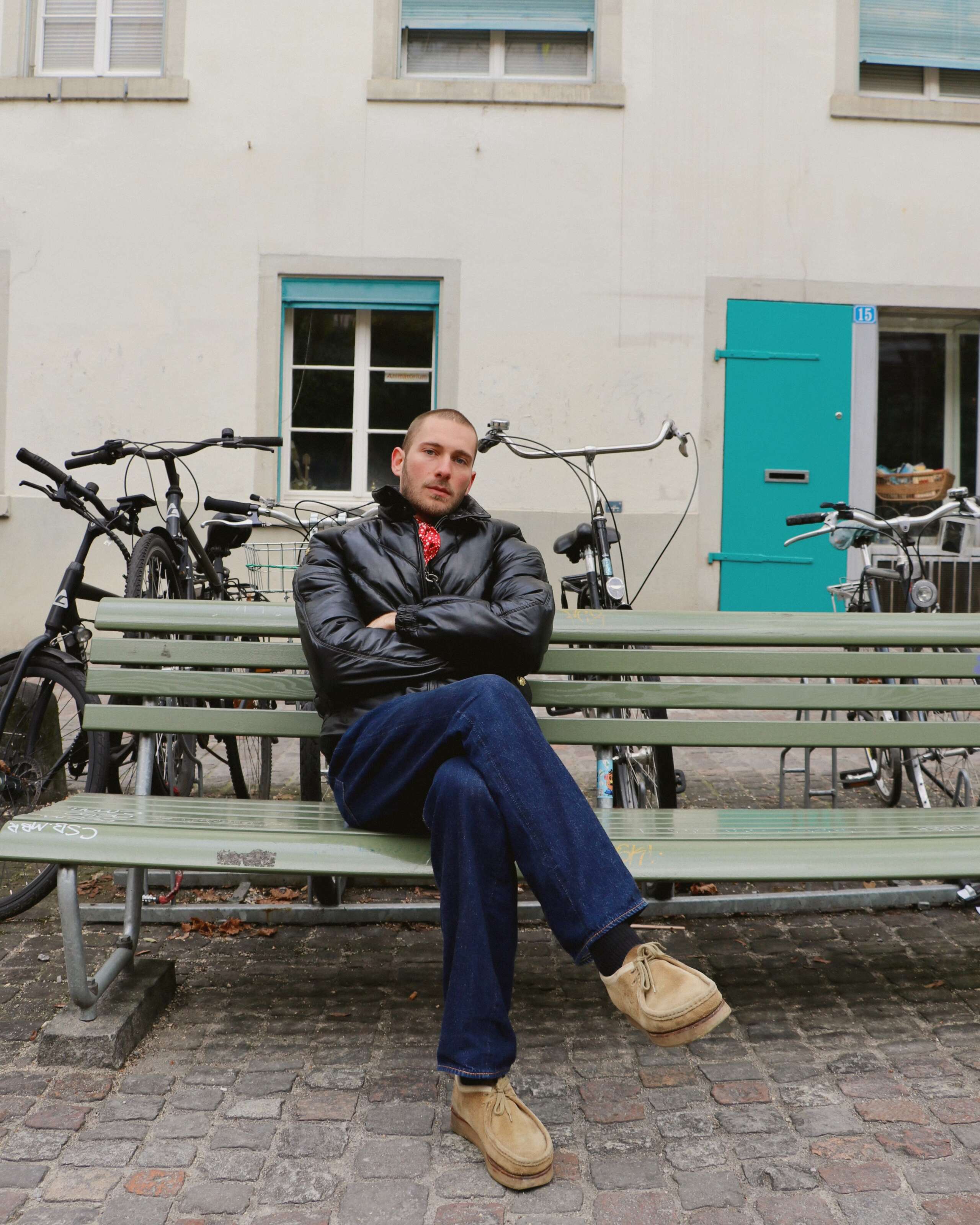 Picture of a young man sitting on a bench
