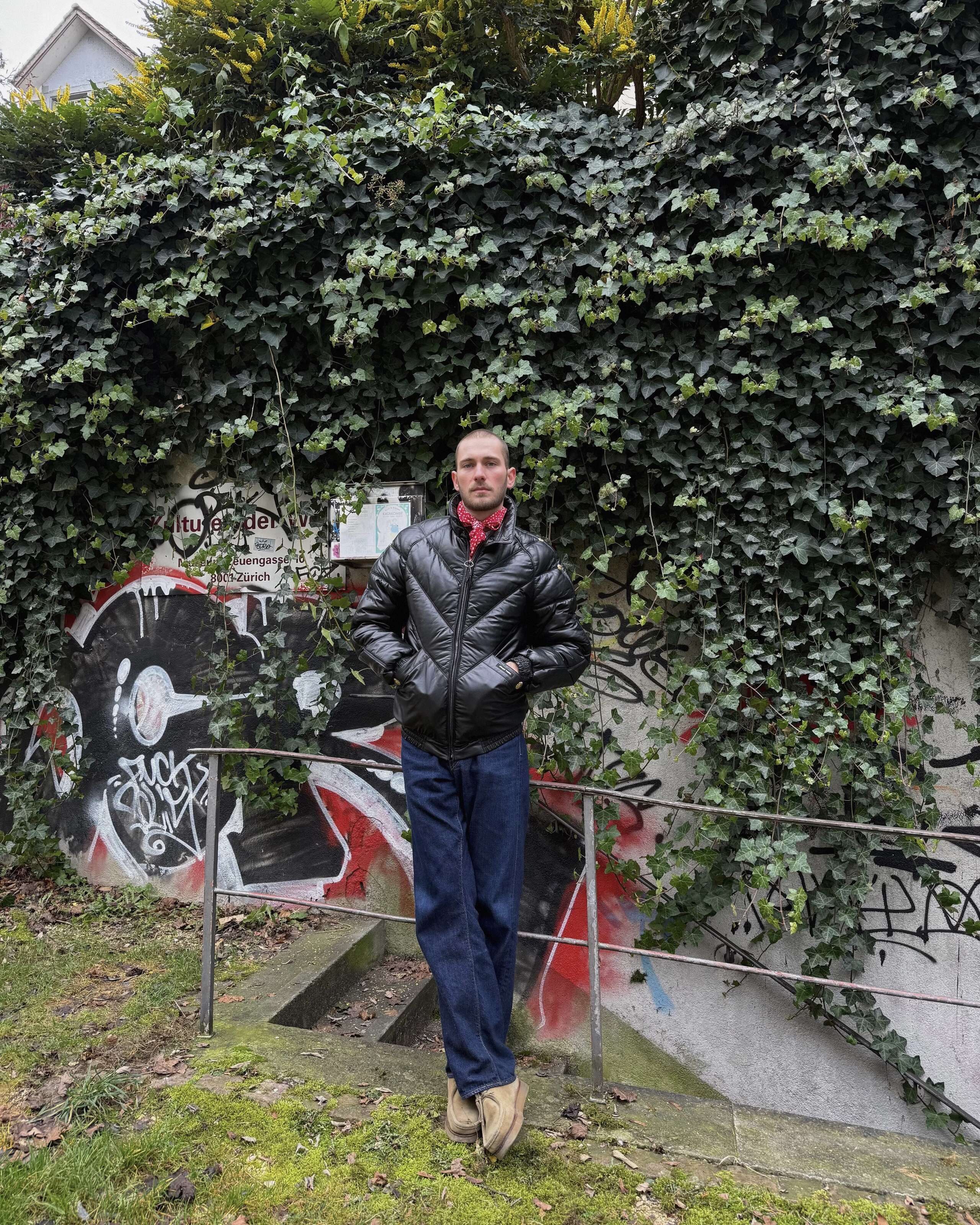 Picture if a man standing in front of a wall