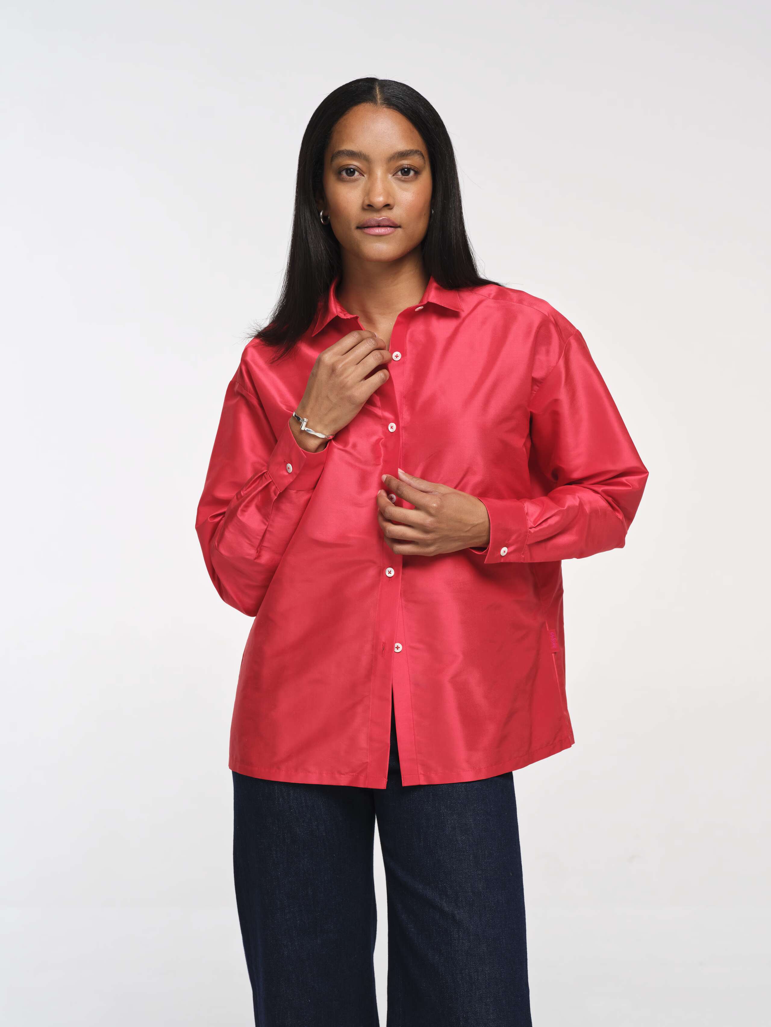 Closeup Front Shot of Model Wearing Warm Red Doupion Francesca Blouse