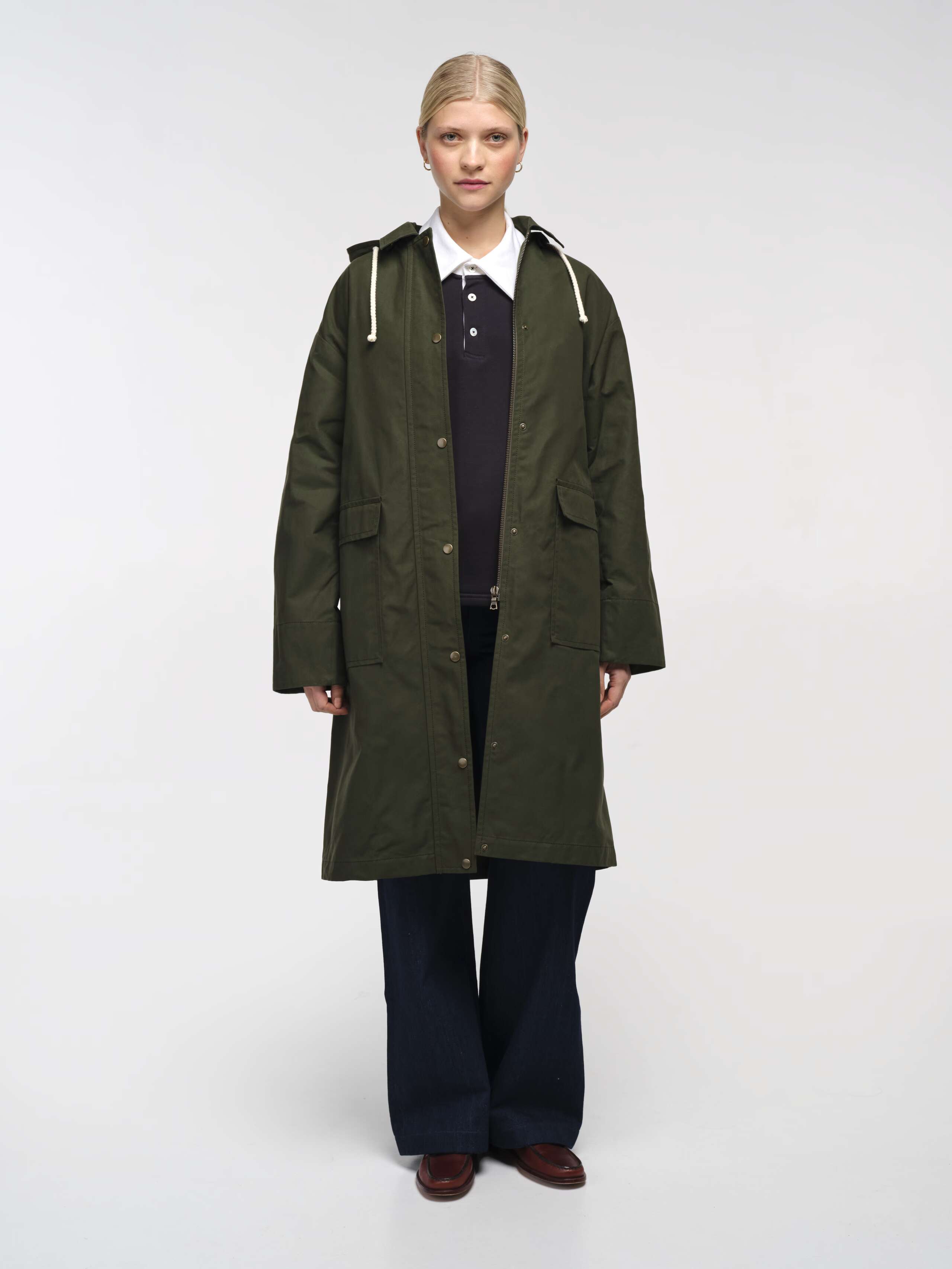 Front Shot of Model Wearing open Ottilia Raincoat in Khaki Green 