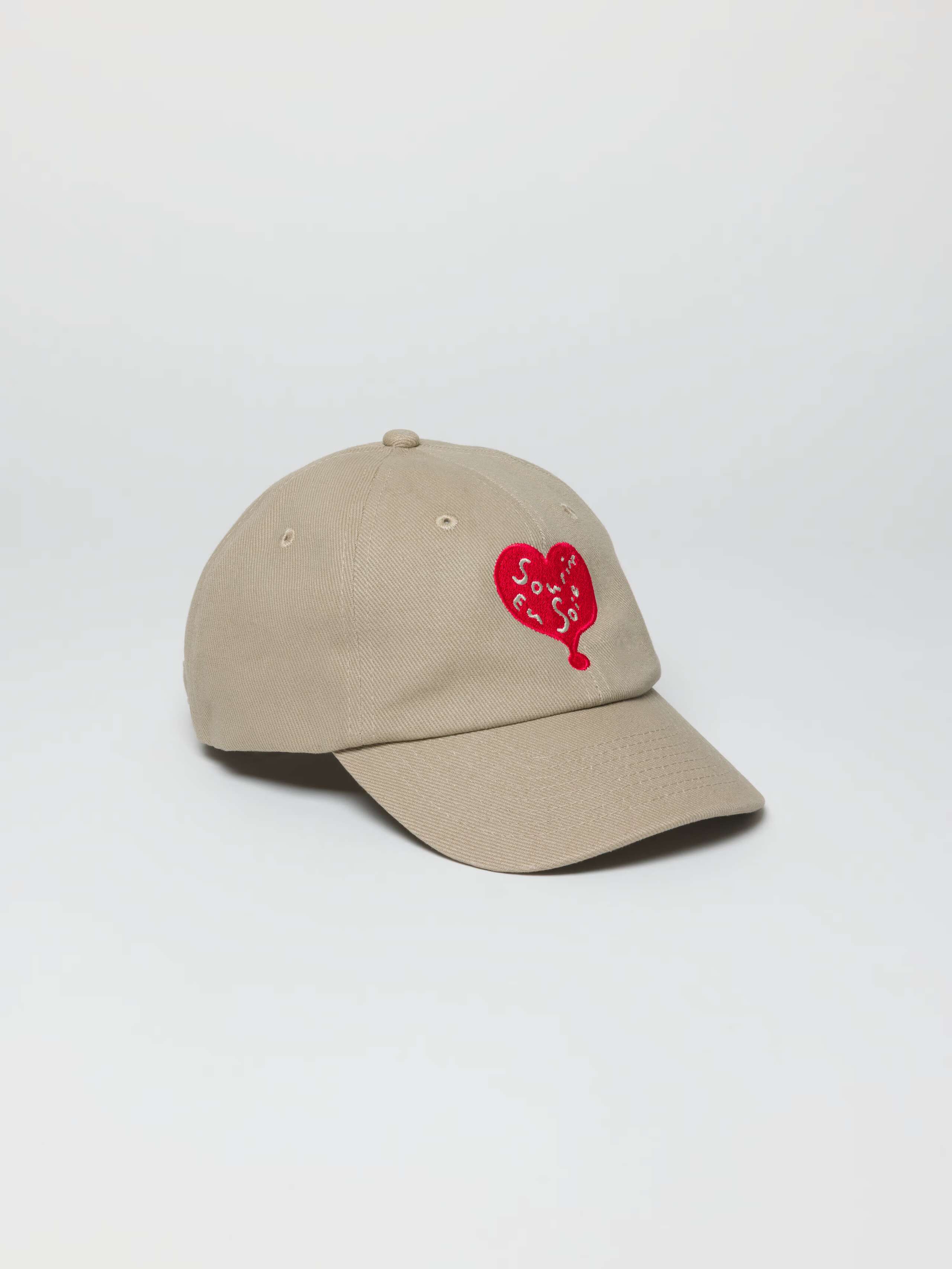 Product Shot of Tommy Cap Beige with Sourire Heart Red Embroidery 