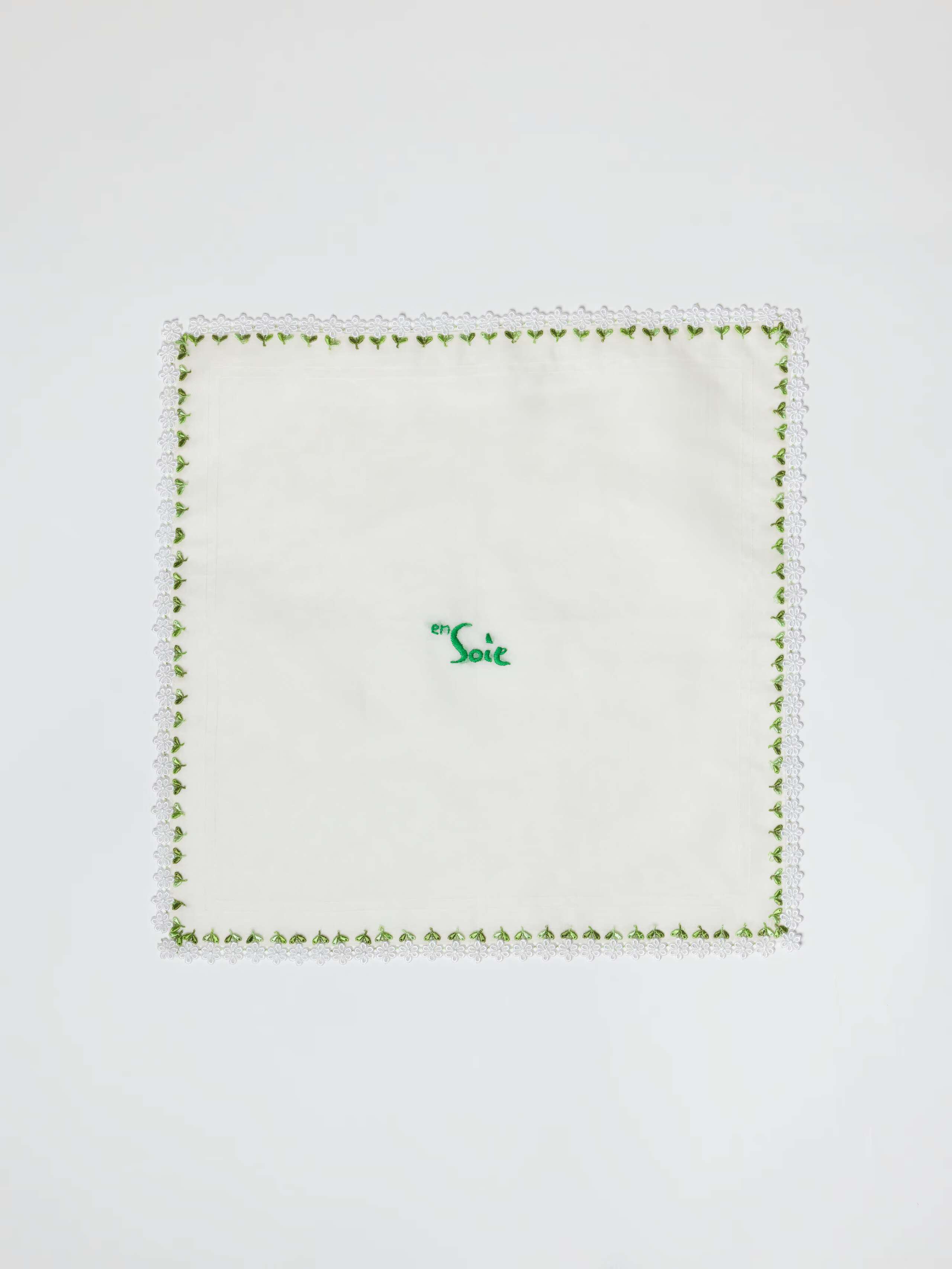 Bibi bowl cover made out of silk. edges hand embroidered with white flowers