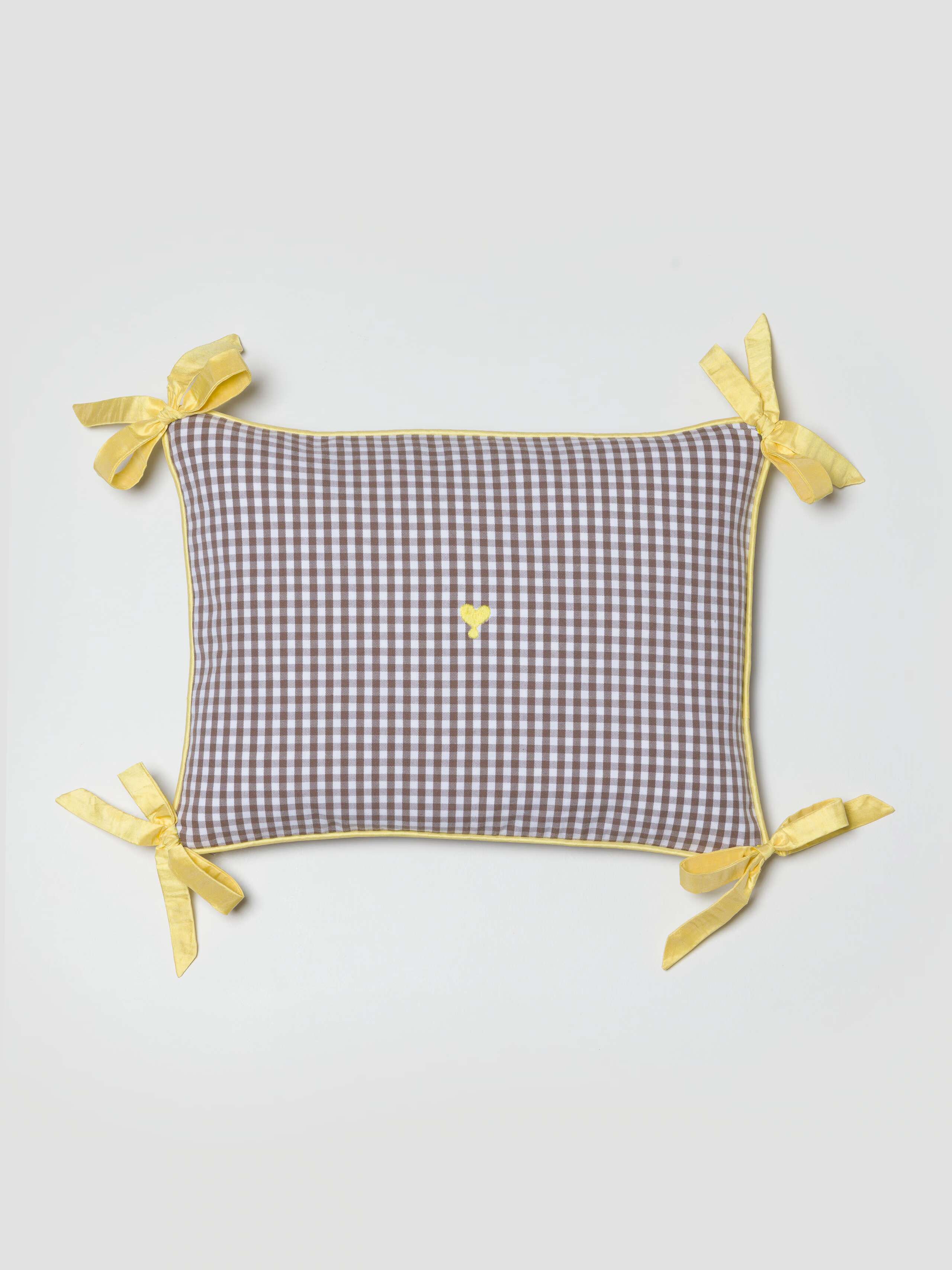 Milo pillow cover in Moonrock with yellow doupion ribbon