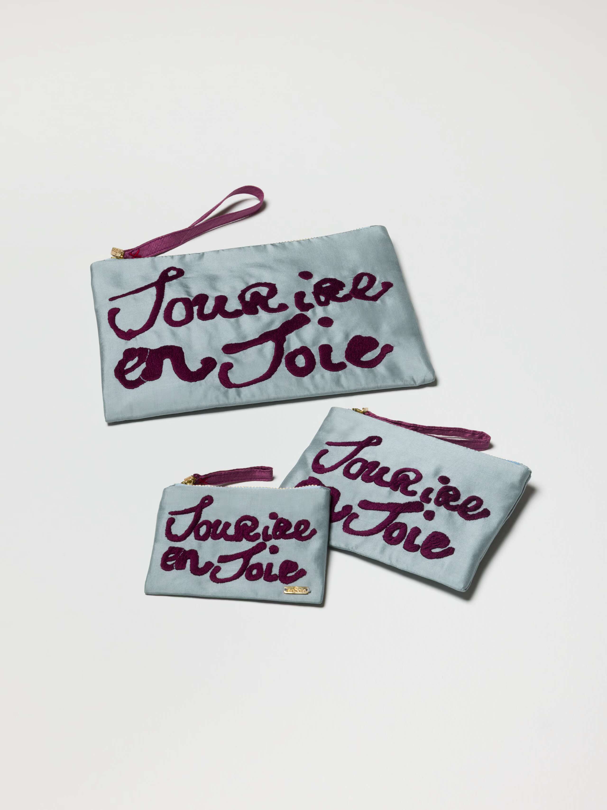 Product Shot of all 3 Proverb Clutches in Dream Blue