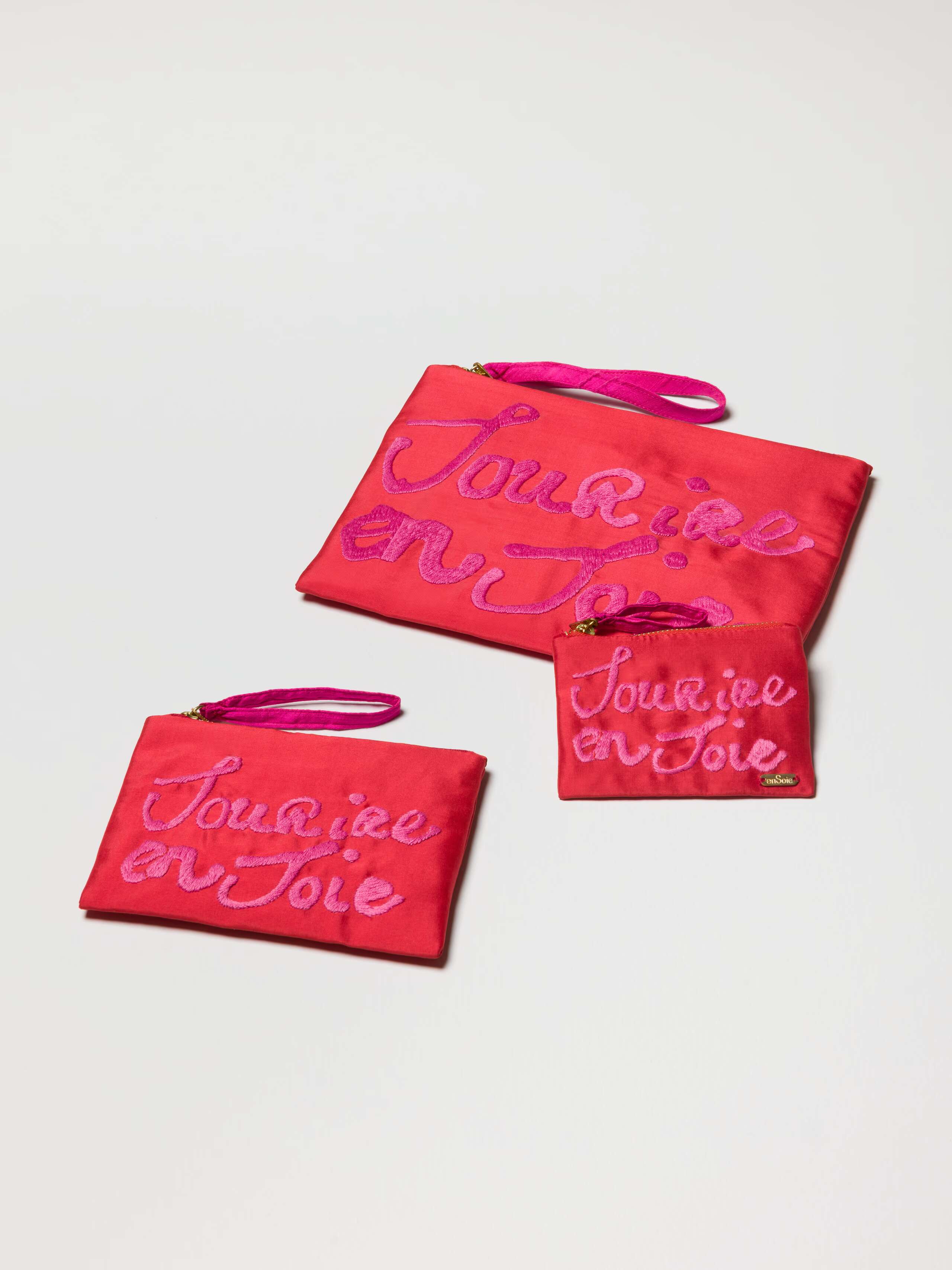 Product Shot of all 3 Proverb Clutches in Warmest Red