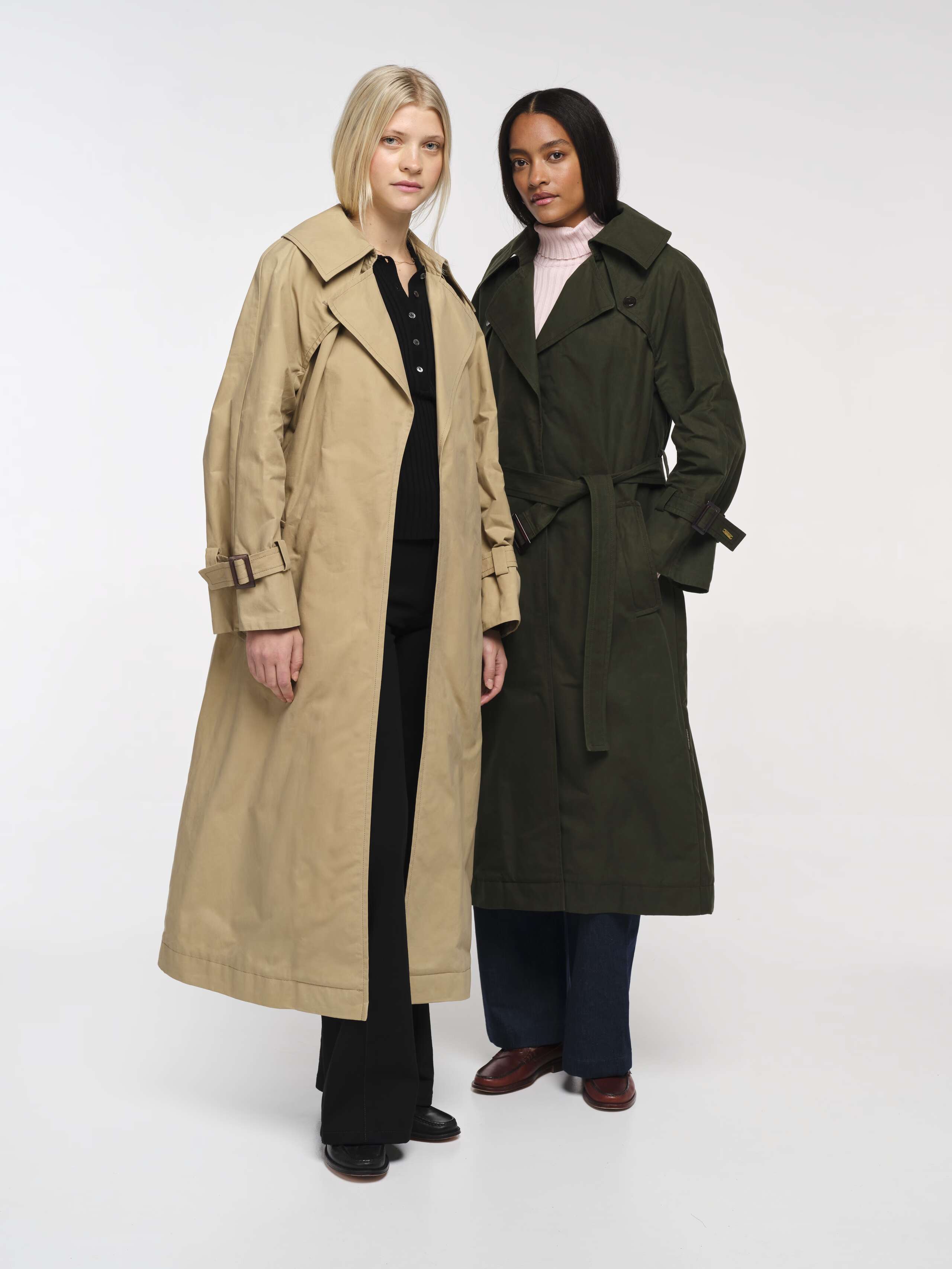 Two women wearing waxed rain coats