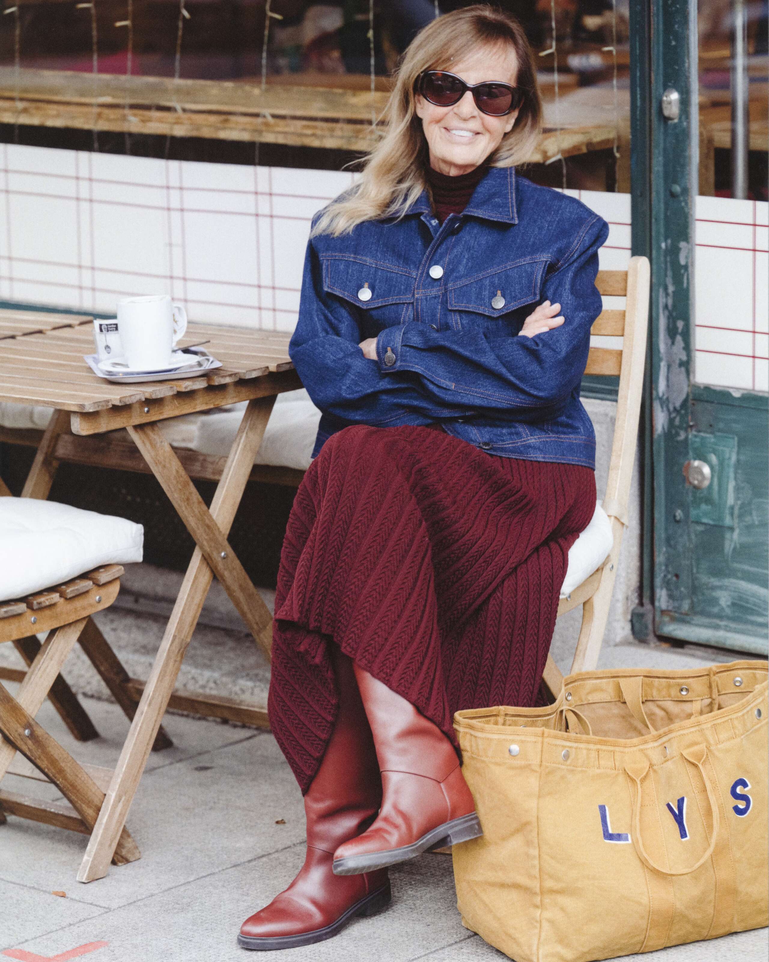 Picture of a women wearing the enSoie denim jacket and Capri sunglasses