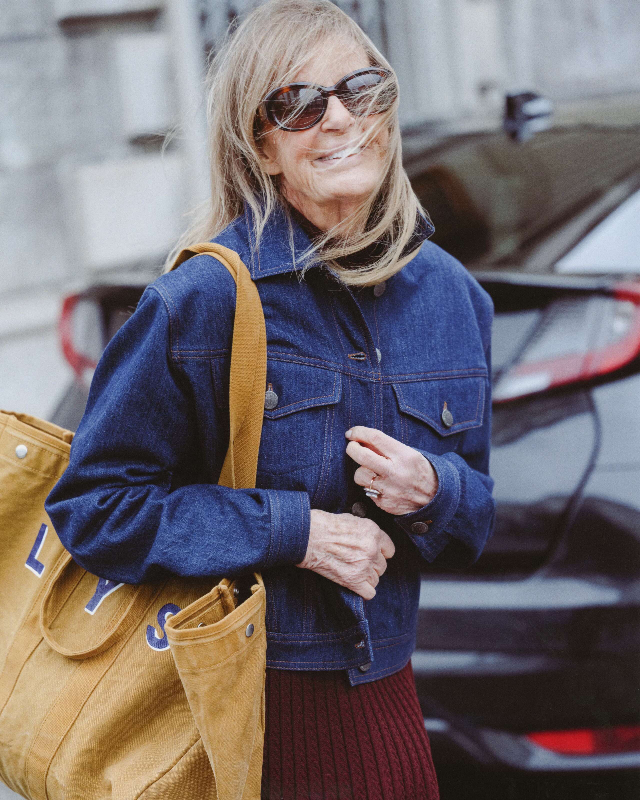 Picture of a women wearing the enSoie denim jacket and Capri sunglasses
