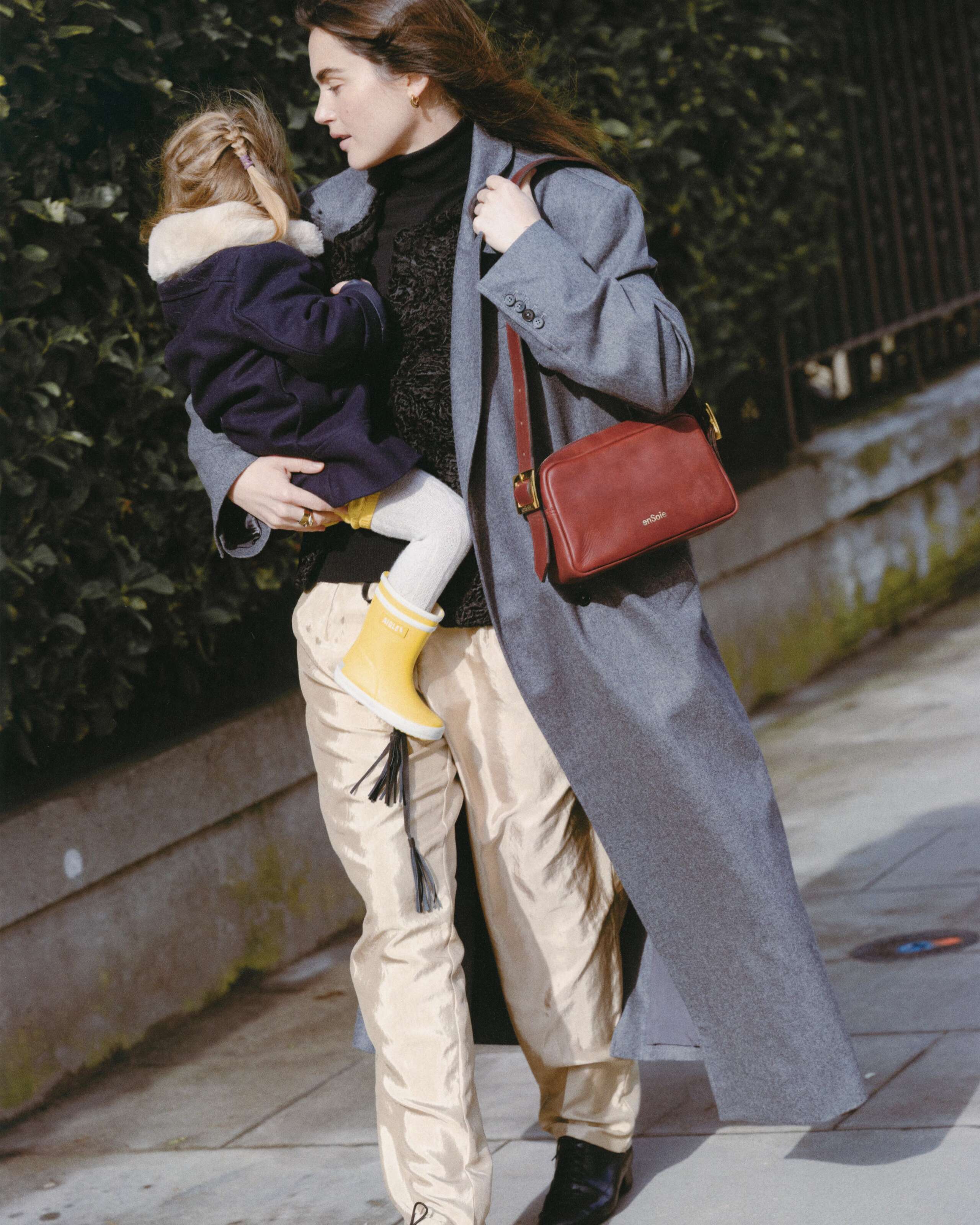 Picture of a women carrying her daughter