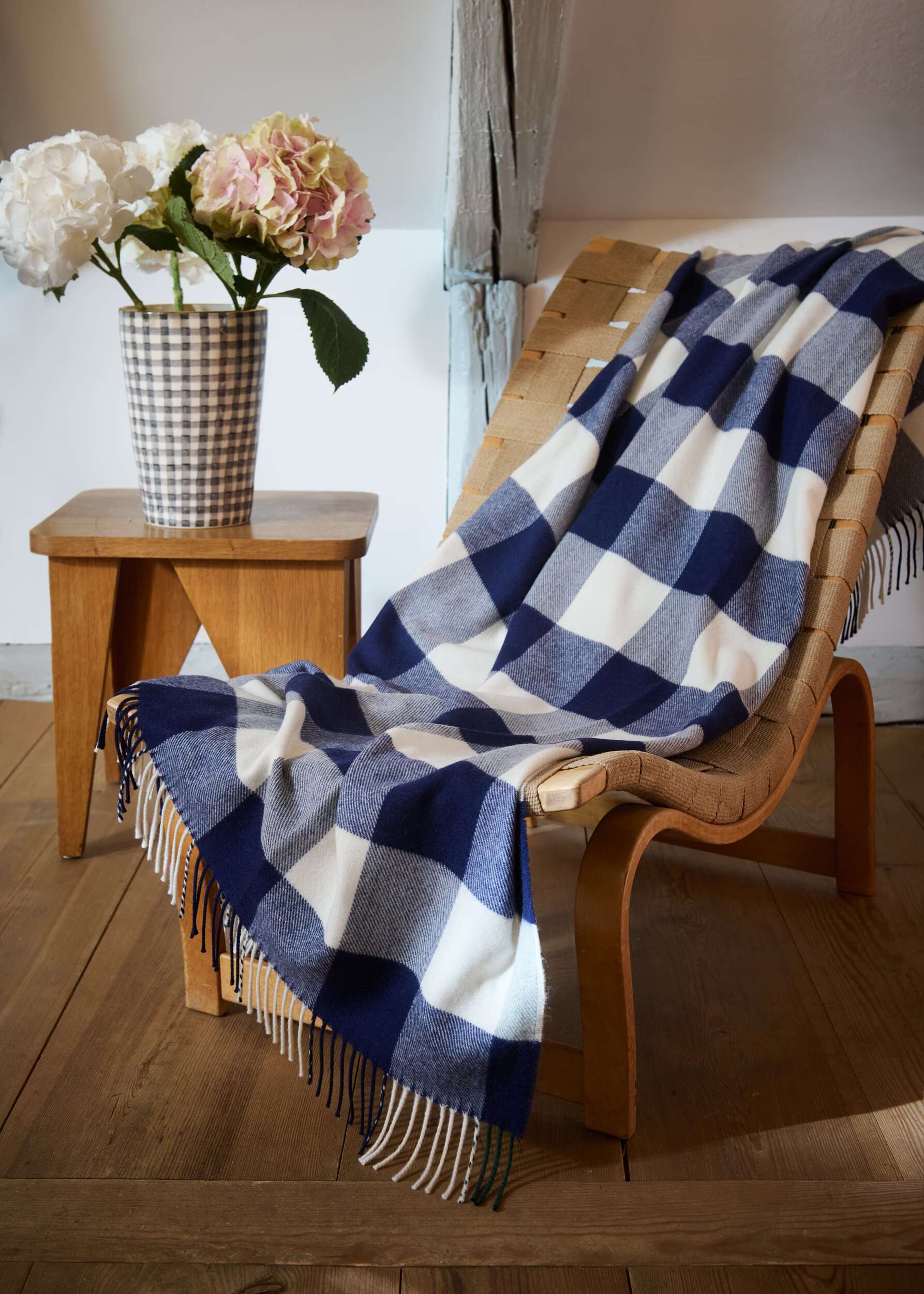 Interior mood of vichy blanket and ceramic vase