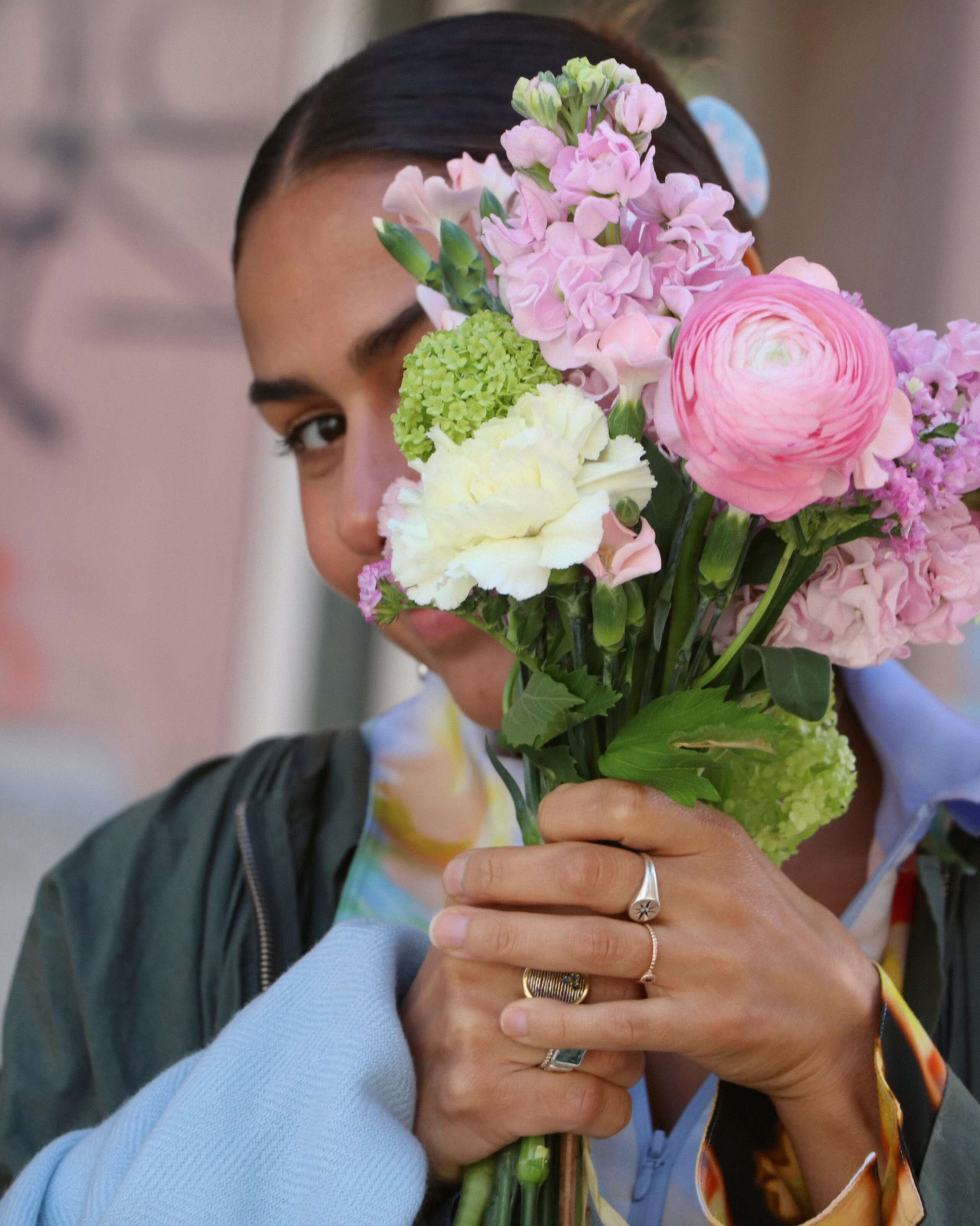 Picture of a women holding a small flower bouquet