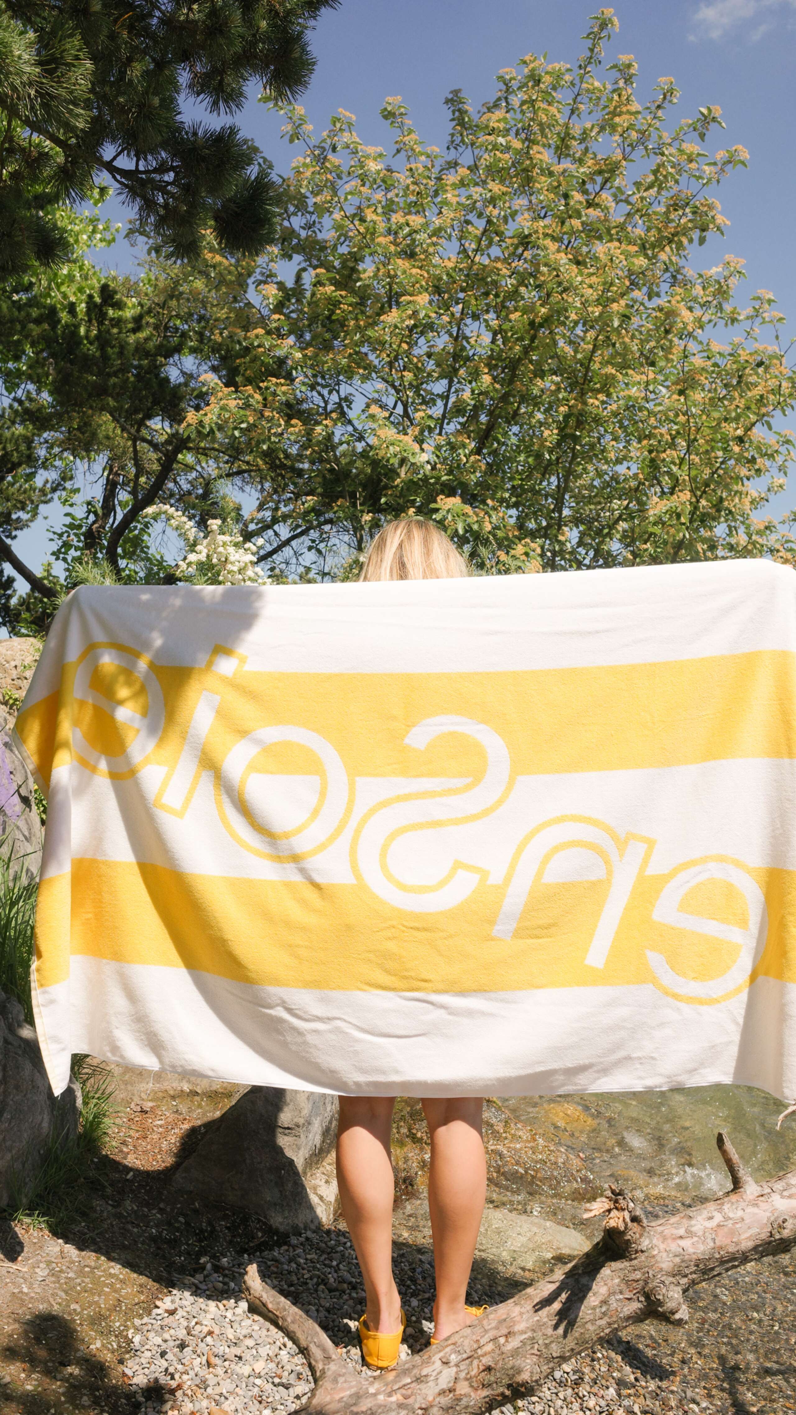 Picture of a women holding a bath towel