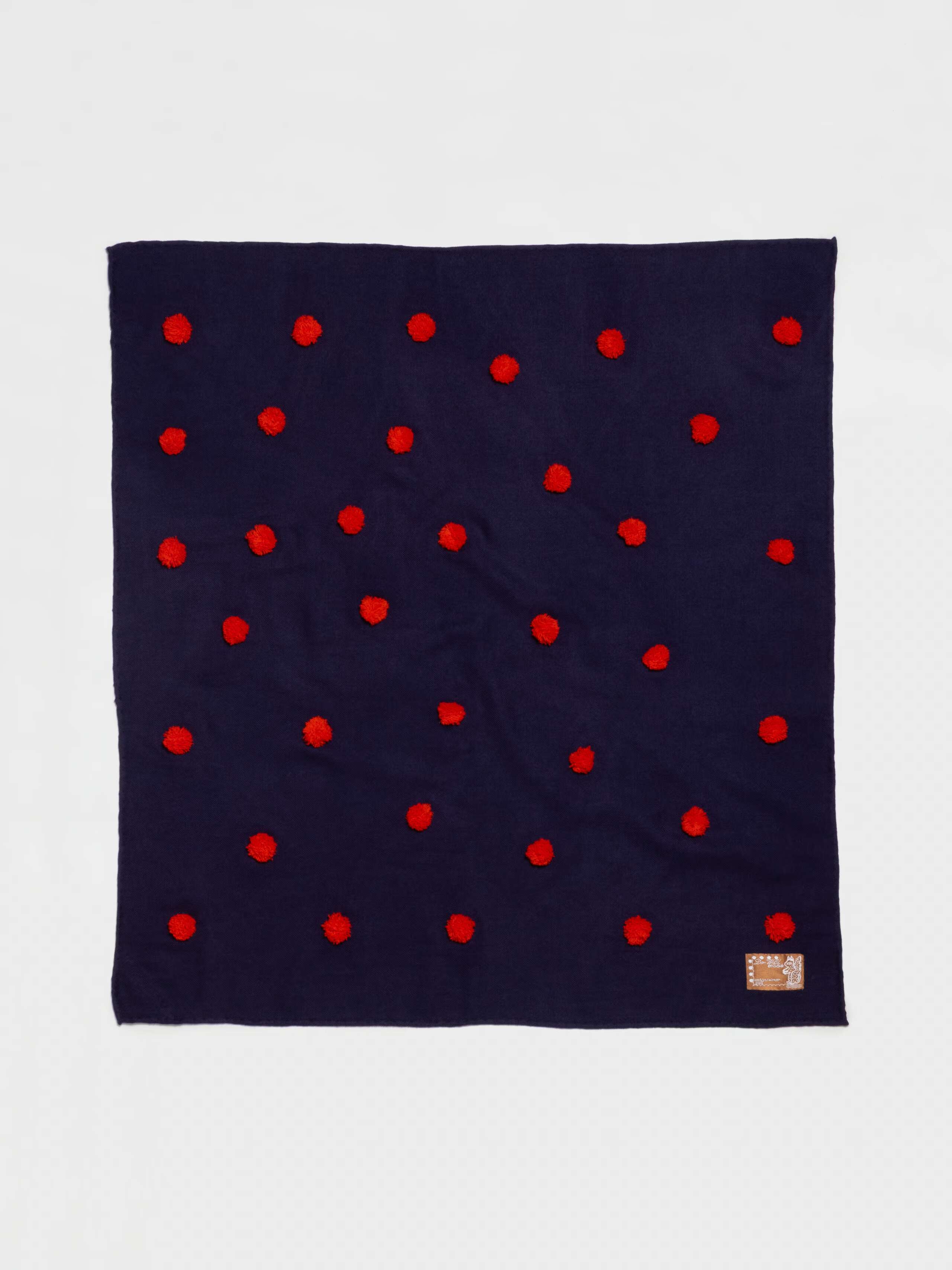Pompon embroidered wool foulard in navy with red pompons