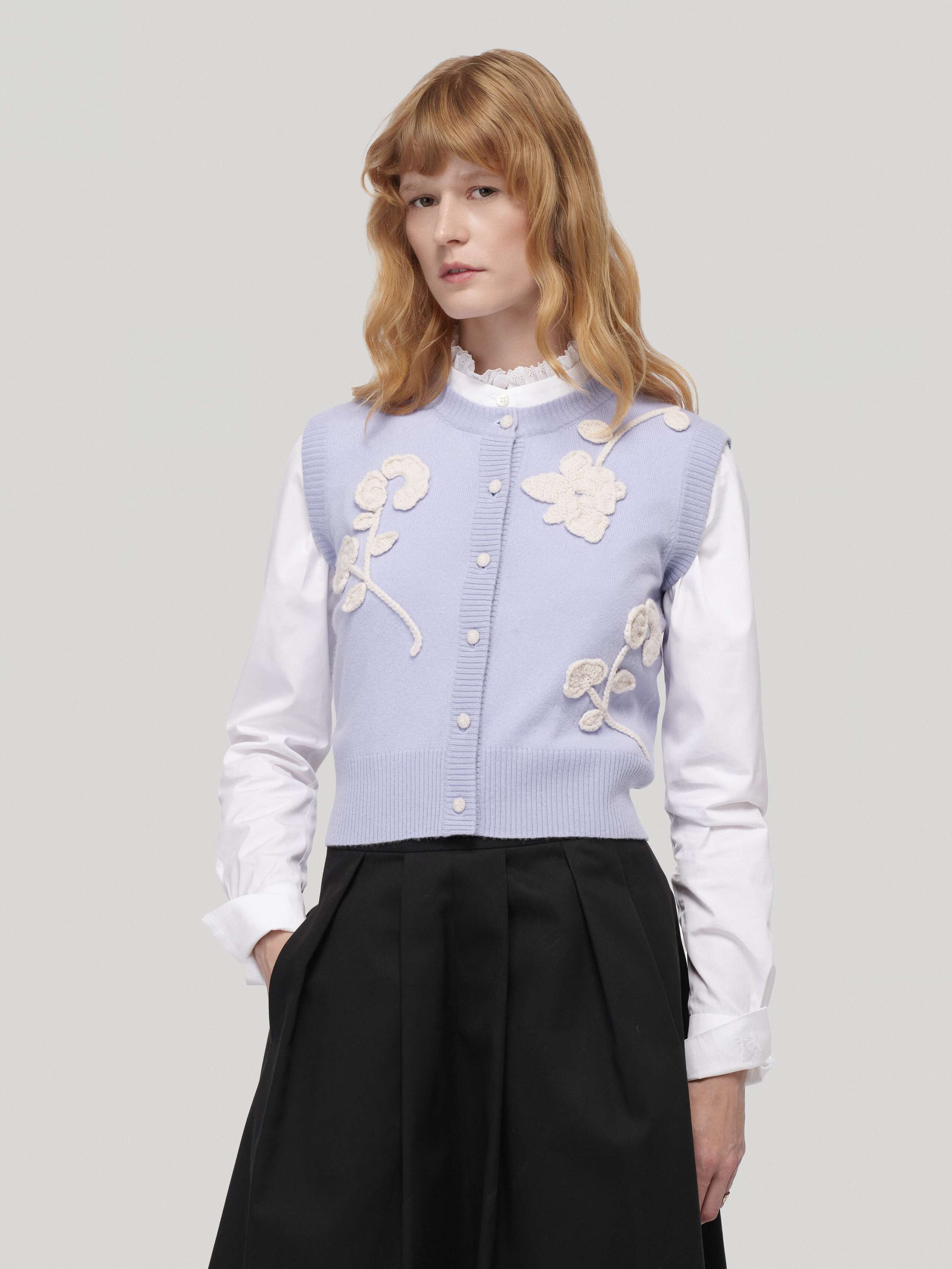 Flurina cashmere vest in light blue with white crochet flowers