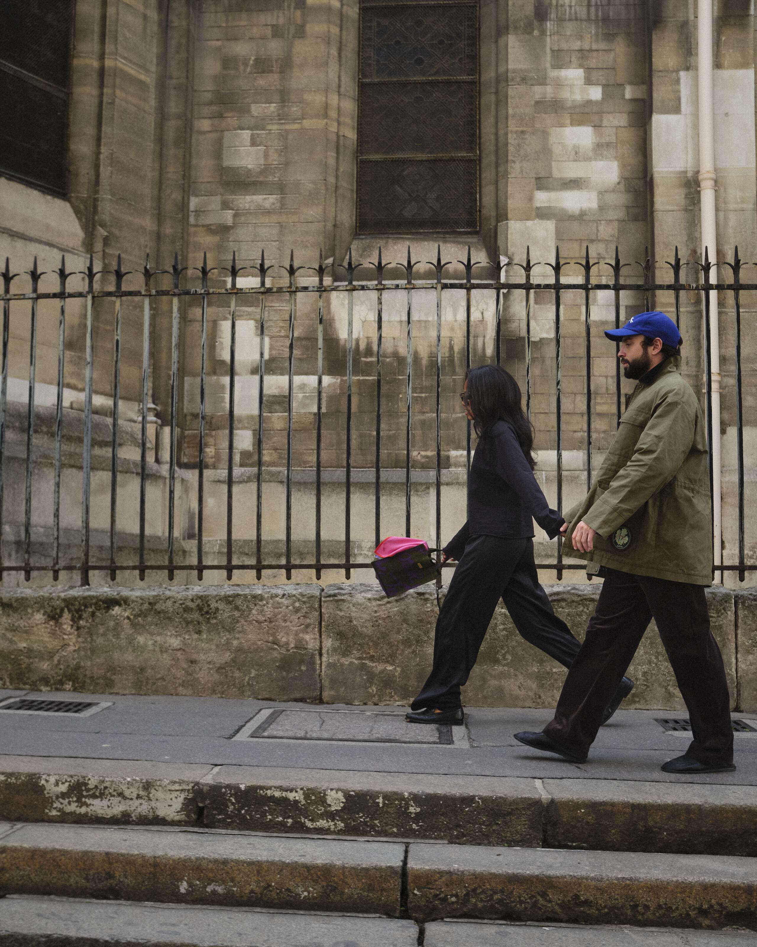 Picture of a couple walking through the streets of Paris.